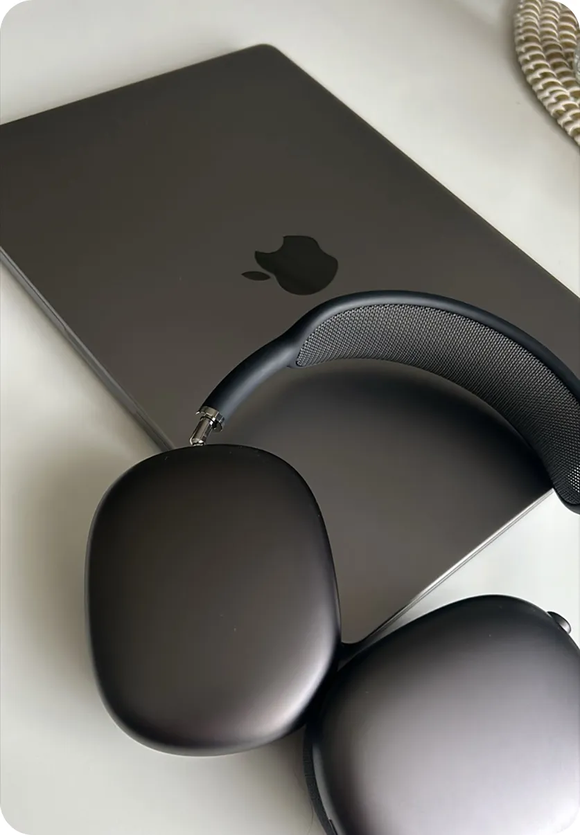 MacBook with AirPods Max resting on top